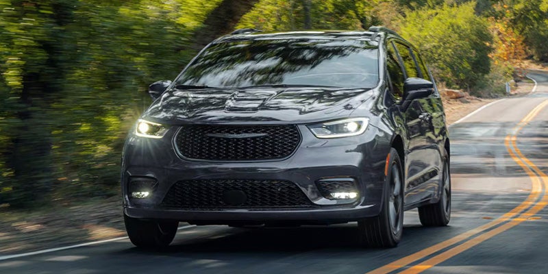 Black Chrysler Pacifica Driving on Road