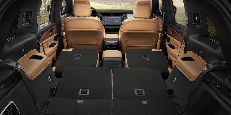 Jeep SUV cargo area with rear seats folded flat for maximum storage space