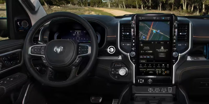 Ram truck interior featuring digital instrument cluster and touchscreen infotainment system
