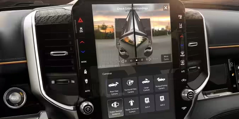 Close-up of Ram Uconnect touchscreen displaying vehicle controls and navigation options