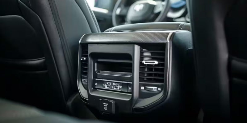 Rear passenger air vents and USB charging ports inside a Ram pickup truck
