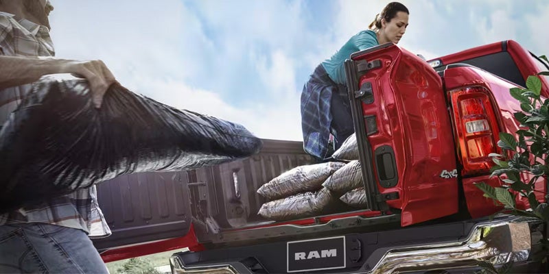 Ram pickup truck cargo bed loaded with outdoor adventure equipment